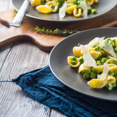 Italian orecchiette pasta with peas and cheese